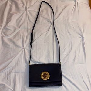 Kate Spade navy blue cross body purse. Adjustable strap.